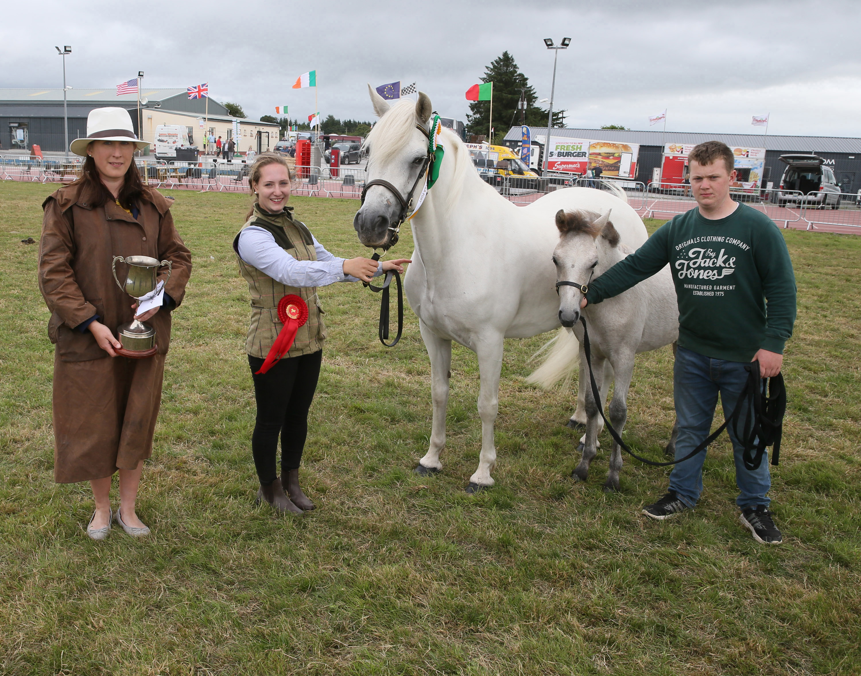 Sarah Conway, (Judge Horse Classes) with the Josie Kerin's Perpetual Cup for Champion Connemara of Show  (sponsored by Ballyhaunis Plant Hire) pictured with Rachel Byrne (granddaughter of Jarlath Grogan, Bekan Claremorris) and Mark Byrne, Tuam. Photo © Michael Donnelly