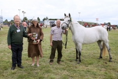 Kevin McHale, Breaffy, Castlebar with Reserve Junior Champion  Connemara and winner in the 3yr old Filly Class as Peter McHugh (Steward) and  Sarah Conway, Waterford (Judge) present him with Canon Moore  Perpetual Cup at Claremorris 100th Agricultural Show 2018. Photo © Michael Donnelly