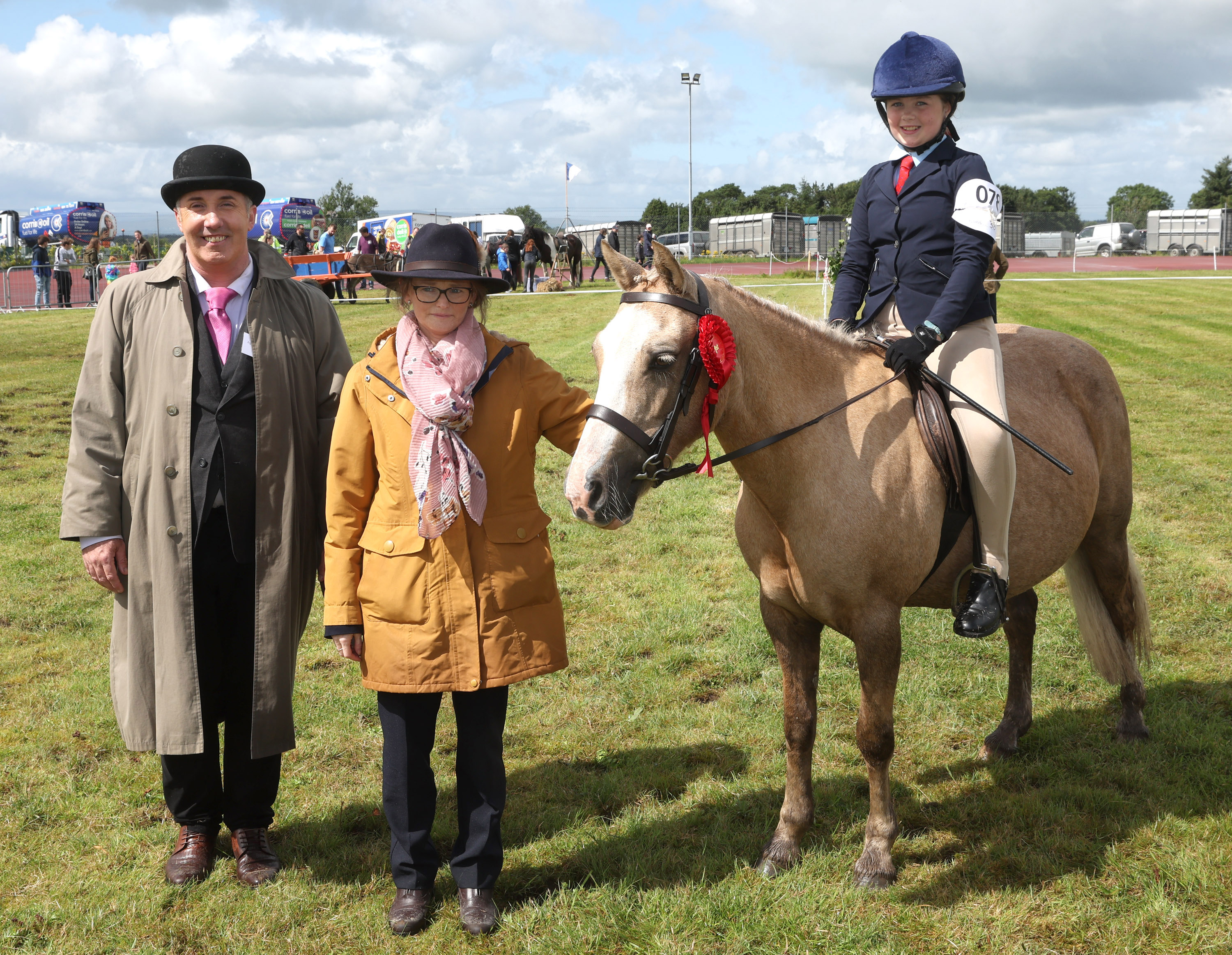 Chloe Hallinan Killawalla Westport Co Mayo winner in Open Show Pony 138 cm rider correct age (sponsored by Townley Medical) at the Claremorris 103rd Show in Claremorris on 5th August, pictured with judges  PJ Watson and Laura McWeeney. Photo © Michael Donnelly