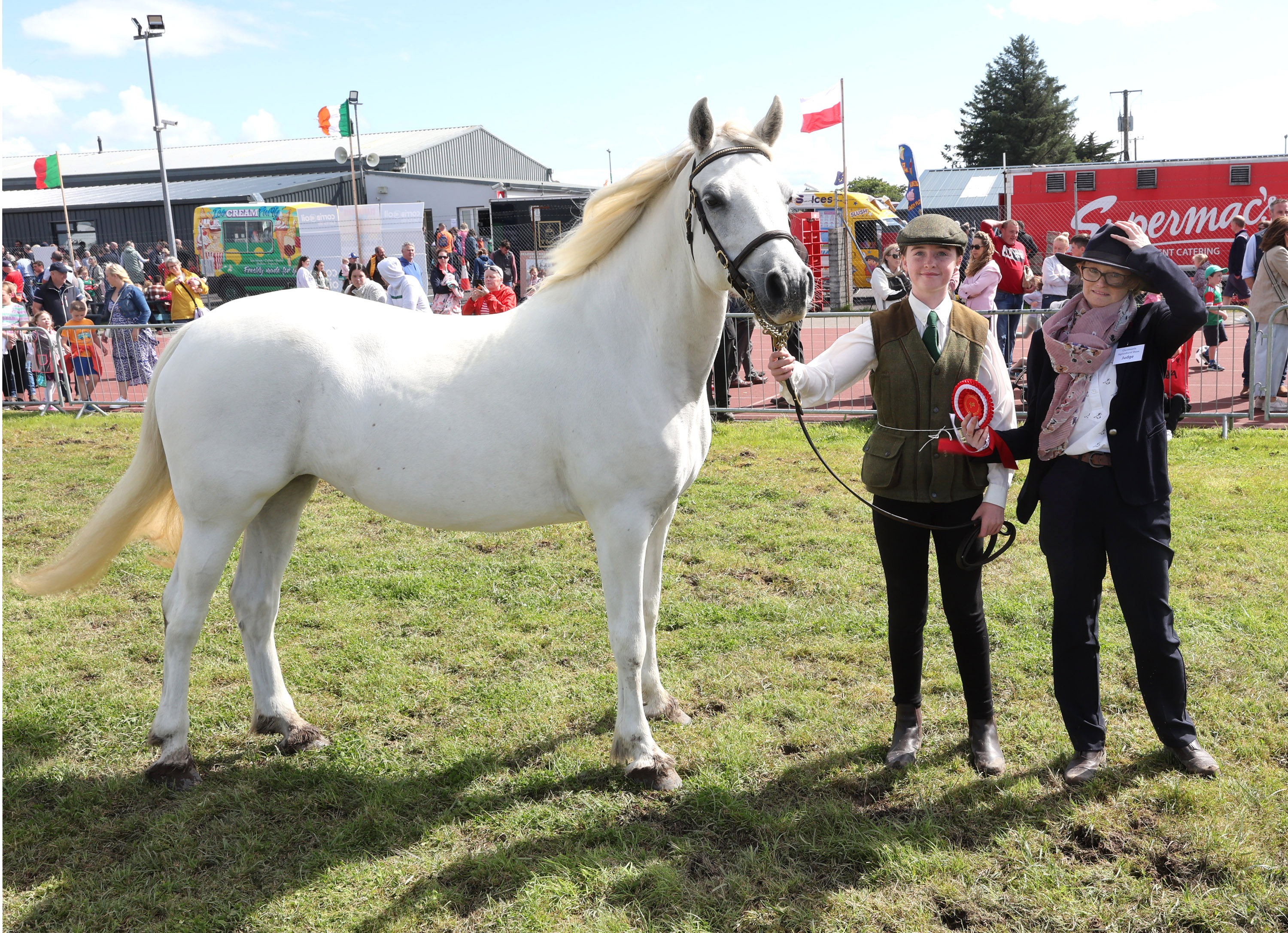 Aoife Gorham,  Ballyconneely Co. Galway was the winner in the "Supermacs & Papa John's Young Handler 11-16 years competition" pictured with Laura McWeeny, Judge at the Claremorris 103rd Show in the Showgrounds Claremorris. Photo © Michael Donnelly