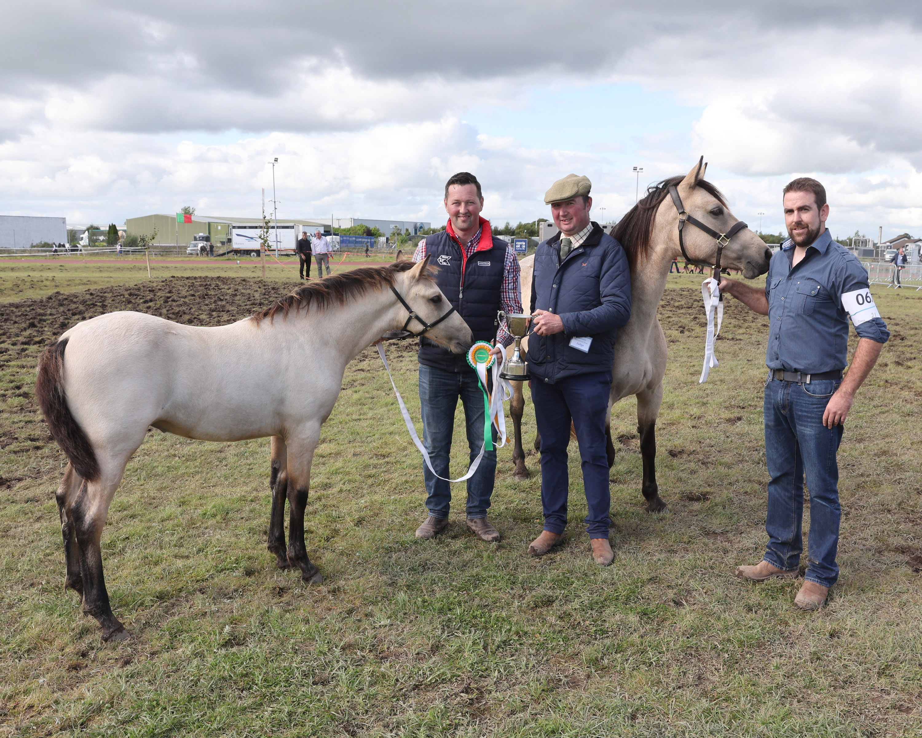 Padraig Hallinan Killawalla Westport Co Mayo is presented with the Cup for  Champion Connemara Pony by Glenn Farrell Walker (Judge) at the Claremorris 103rd Show in Claremorris on 5th August Included is Matthew Newell. Photo © Michael Donnelly