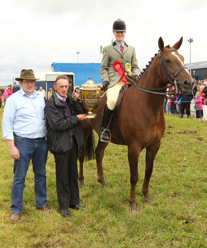 Oliver Brennan, (grand nephew of the  late Oliver Dixon) presents the Oliver Dixon Gold Cup to Petra Hewer, Derrada, Westport, Co Mayo for Champion ridden Hunter of Show, included on left is Tom Byrne, Chairman Claremorris Agricultural Show. Photo: © Michael Donnelly (Mayopics)