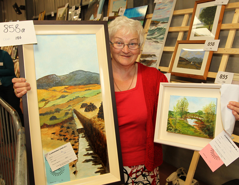 Marie Creighton, Claremorris pictured with her prize winning paintings including 1st in Open category at the 94th Claremorris Agricultural Show. Photo: © Michael Donnelly Photography