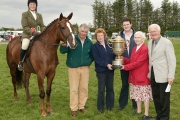 The Oliver Dixon Gold Cup for “The Champion Hunter  of Claremorris Show  under saddle” was “Ginger Holly” ridden by Annette Walsh McMullen, Ballina, pictured at the presentation from left Tony and Irene Walsh James McMullen, Poppy Dixon, and Cormac Hanley PRO. Photo Michael Donnelly