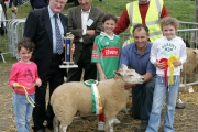 Joe Gilligan presents the Gilligan Trophy for Champion Crossbred Ewe lamb at the 88th Claremorris Agricultural Show, to Walter Brennan. Included in photo from left; Aoife Brennan, Brenda Finlay,  Walter Brennan and Laura Brennan. At back: Joe Gilligan, Patsy Reilly (judge) and John Walter, show steward. Photo: © Michael Donnelly